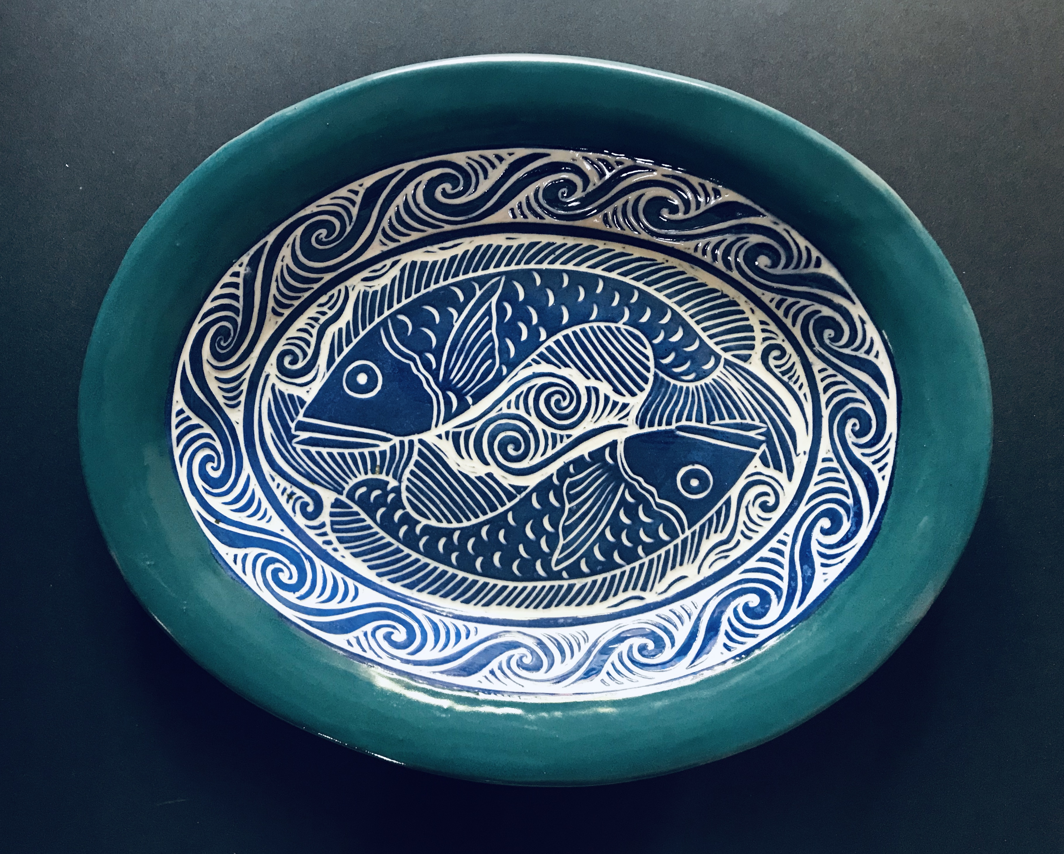 Oval Serving Dish In Blue and Turquoise with Sgrafitto Carved Fish Design